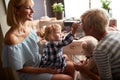 Child putting eyes shadows to grandmotherÃ¢â¬â¢s eyes